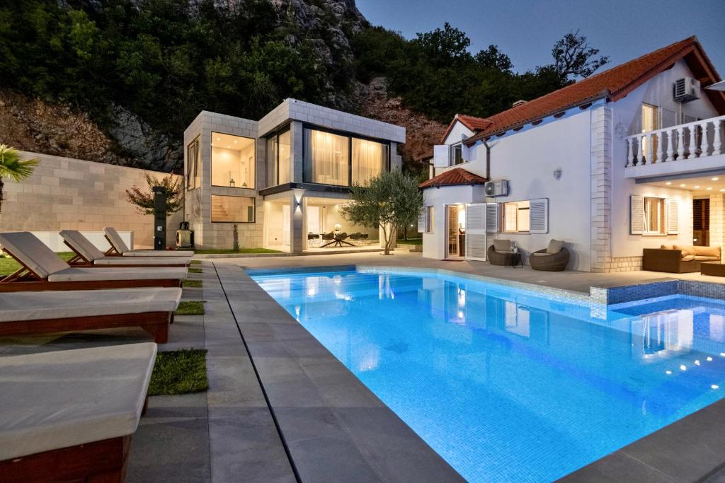 Kids splashing water at a family holiday park in Germany by the lake on a sunny day
